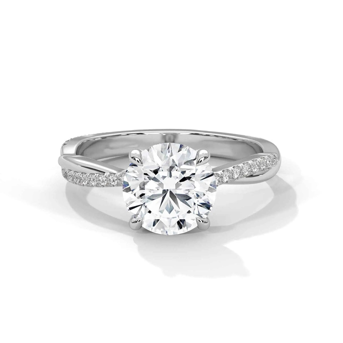 Round diamond ring with white metal twisted band and side pavé accents
