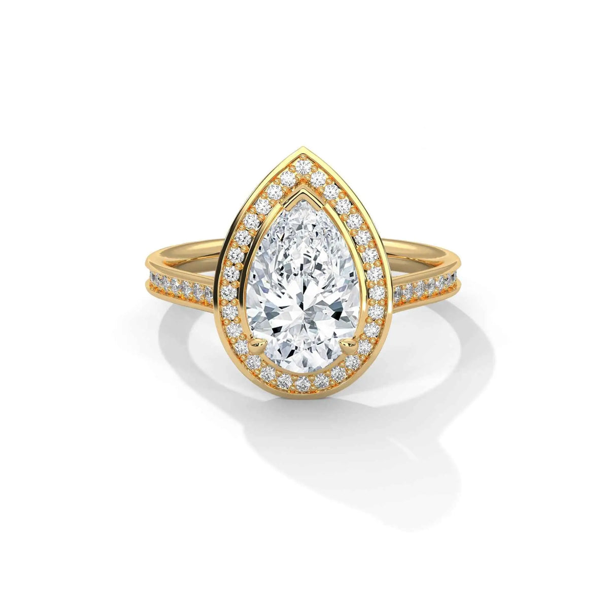 Pear halo diamond ring, yellow gold with large pear center and pavé accents.