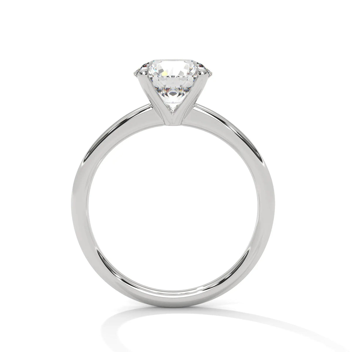 White metal solitaire ring with round center diamond and four-prong head