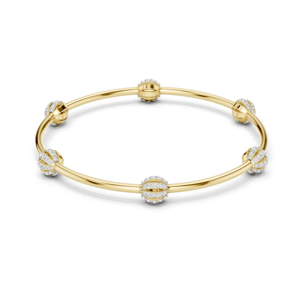 Gold-tone bangle bracelet with crystal pavé links and round central charm