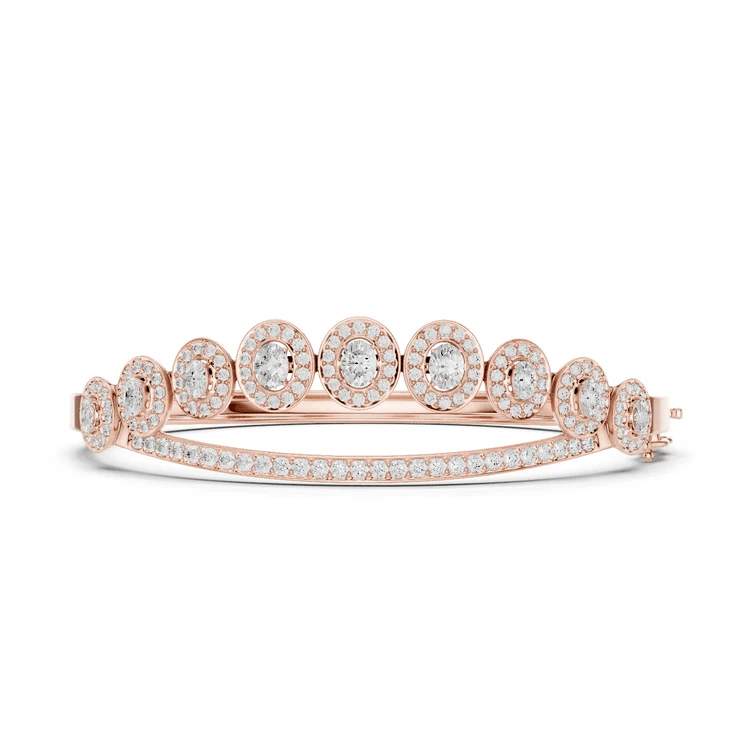 Oval halo bangle ring with raised round center stones and pavé band, rose gold