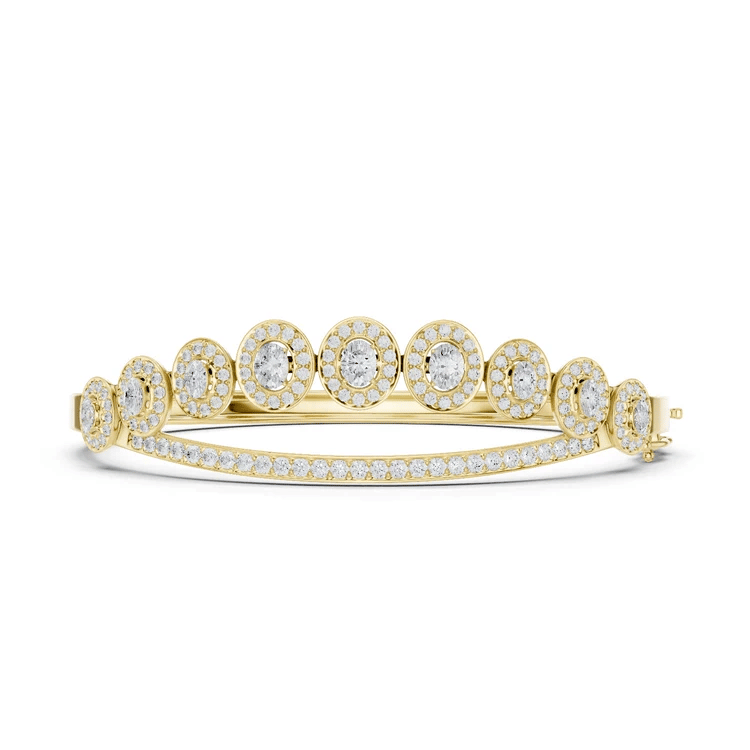 Oval halo bangle ring with raised round center stones and pavé band, yellow gold