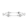 White gold round diamond bangle with floral cluster accents and slim bar design.