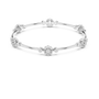 White gold diamond bangle with round clusters spaced along a slim bracelet cuff.