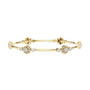 Yellow gold hinged diamond bangle with round clusters and linear bar segments.