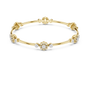 Yellow gold round diamond bangle with floral clusters along the slim cuff.