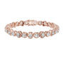 Rose gold cushion-cut diamond tennis bracelet with oval-style links and round diamonds.