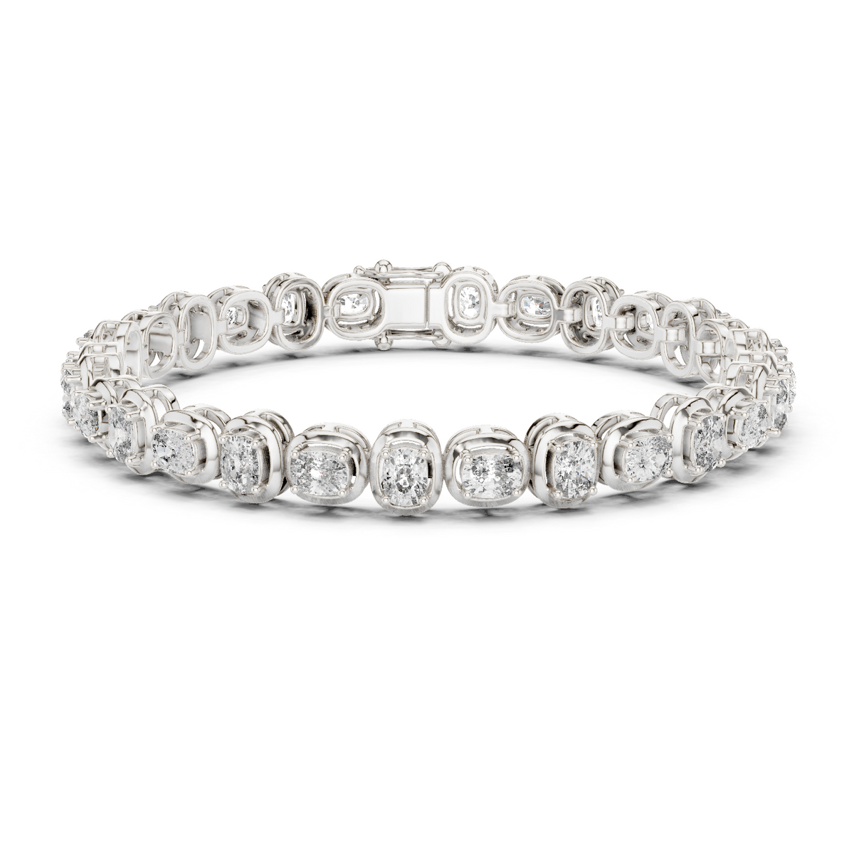 White gold cushion-cut diamond tennis bracelet with oval-style links and round diamonds.