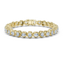 Yellow gold cushion-cut diamond tennis bracelet with oval-style links and round diamonds.