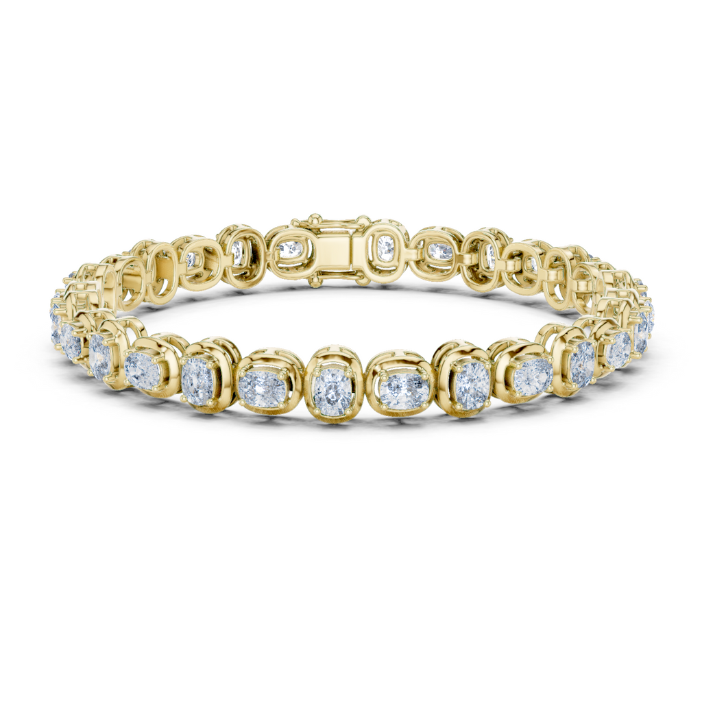 Yellow gold cushion-cut diamond tennis bracelet with oval-style links and round diamonds.