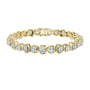 Yellow gold cushion-cut diamond tennis bracelet with oval-style links and round diamonds.