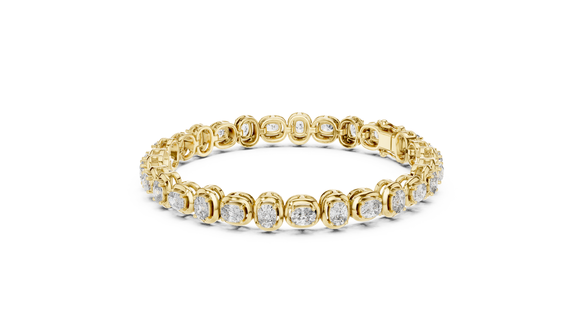 Yellow gold diamond tennis bracelet with cushion-cut stones in a linked chain design