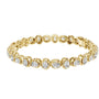 Yellow gold diamond tennis bracelet with cushion-cut stones in a linked chain design