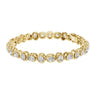 Yellow gold diamond tennis bracelet with cushion-cut stones in a linked chain design