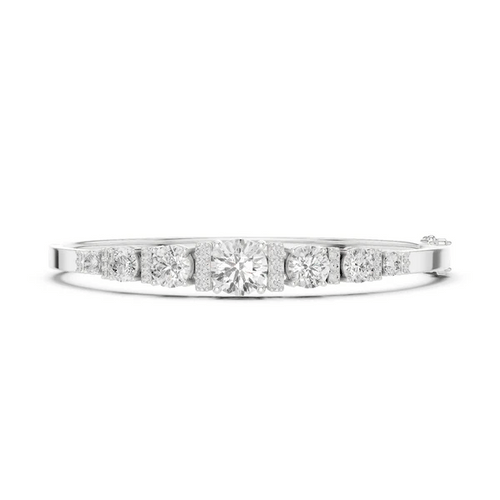 White gold graduated diamond bangle with seven round stones