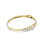 Yellow gold diamond bangle with 7 round graduated stones, side view.
