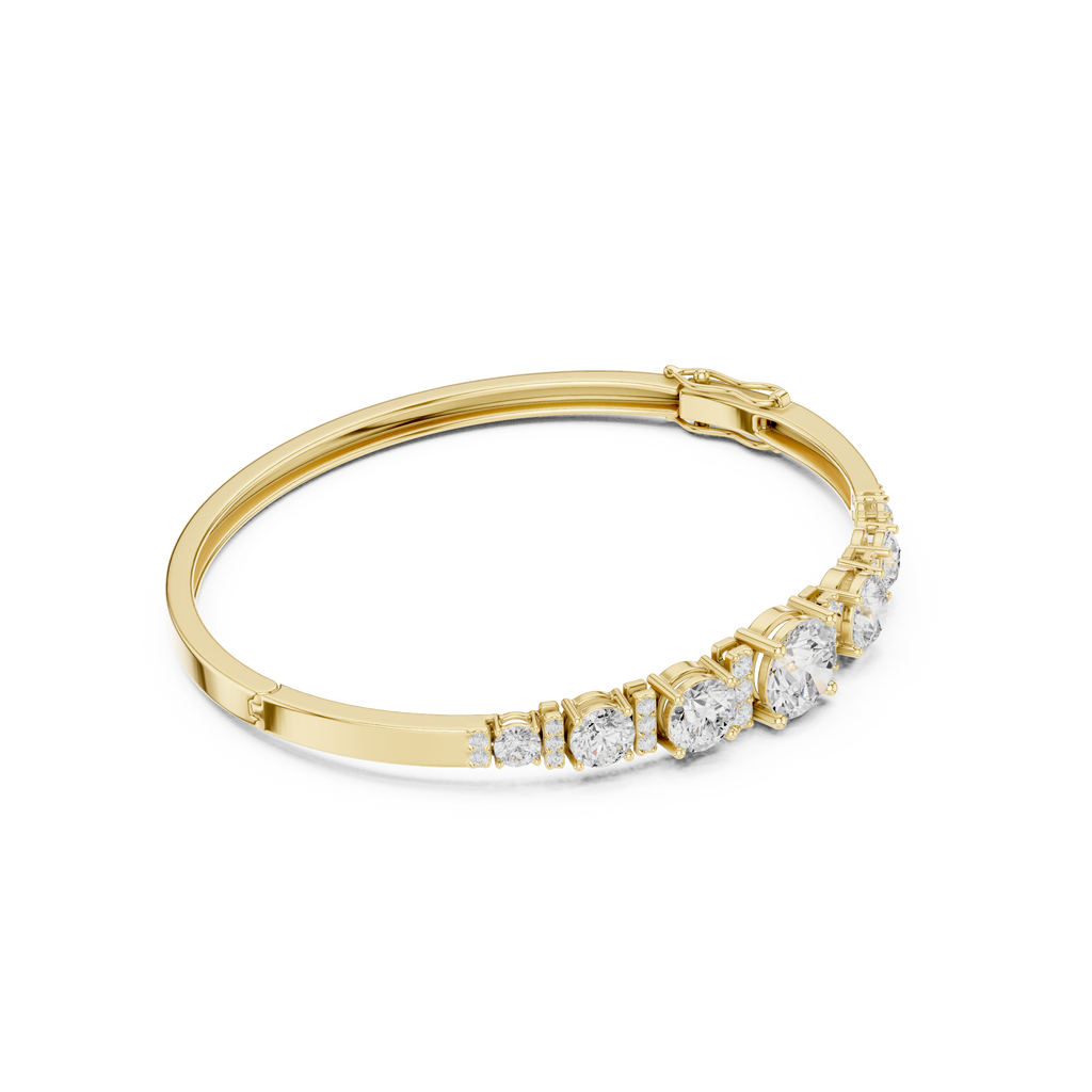 Yellow gold diamond bangle with graduated round stones and hinged clasp detail