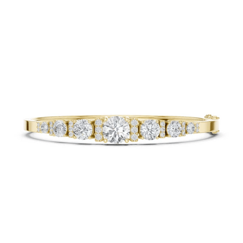 Yellow gold graduated diamond bangle with seven round stones, side profile