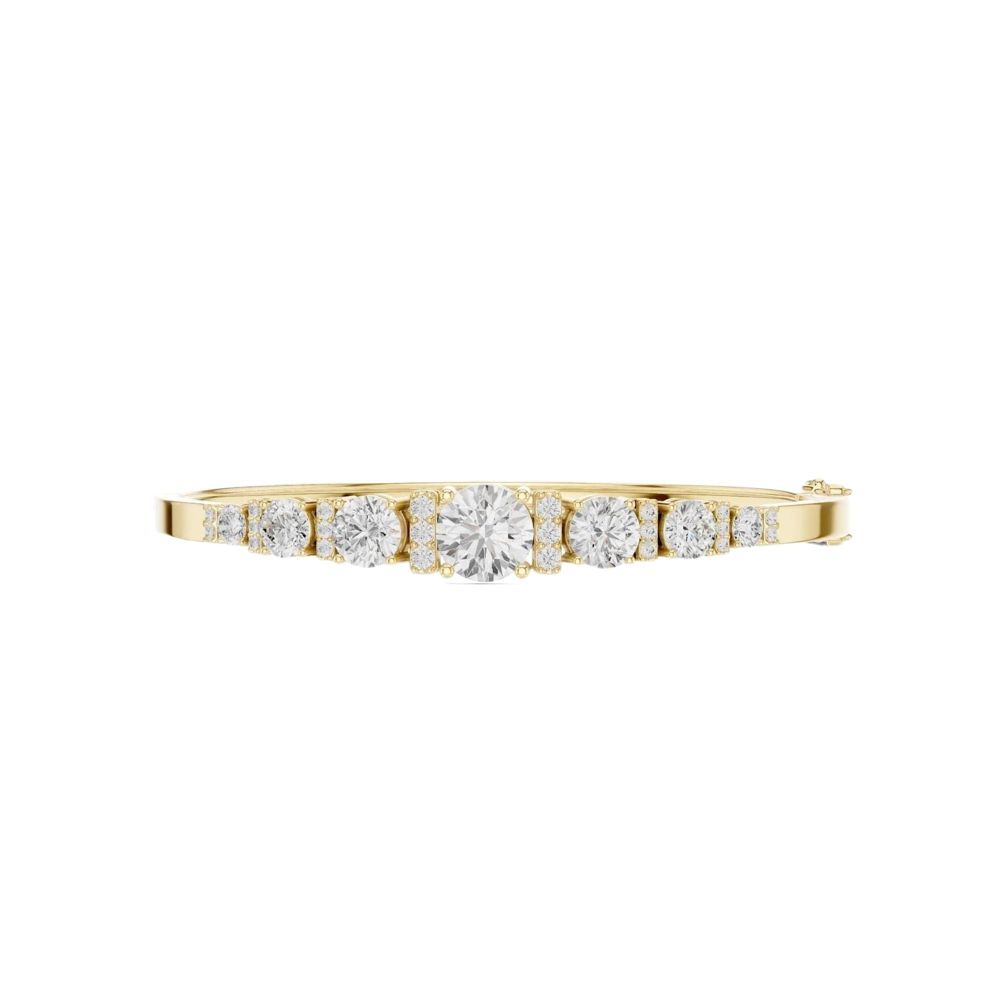 Yellow gold diamond bangle with 7 round graduated stones in a row.
