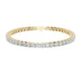 Two-row diamond tennis bracelet in yellow gold with round stones and center box clasp.