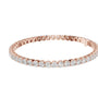 Two-row diamond tennis bracelet in rose gold with round stones, side profile view.