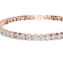 Diamond tennis bracelet with round diamonds, rose gold metal, side angle view
