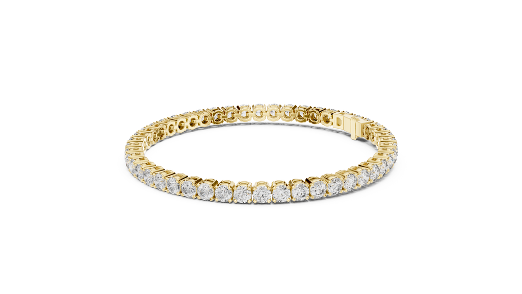 Diamond tennis bracelet in yellow gold with round pavé stones and centered clasp