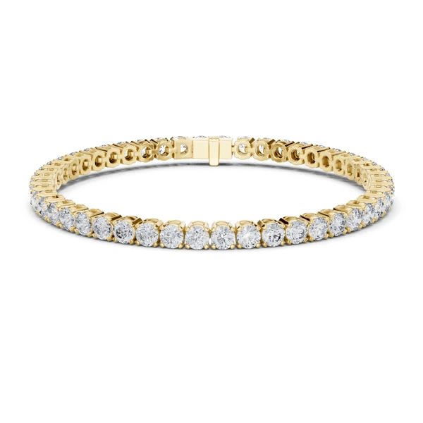 Diamond tennis bracelet in yellow gold with round pavé diamonds and hinged center clasp