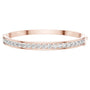 Rose gold channel-set diamond bangle with round stones, hinged fit.