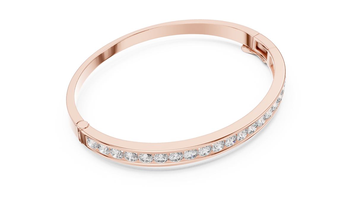 Rose gold diamond bangle with round channel-set stones, angled view.