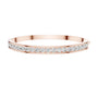 Yellow gold channel-set diamond bangle with round stones, full front view.
