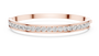 Yellow gold channel-set diamond bangle with round stones, full front view.