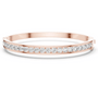 Rose-gold diamond channel-set bangle with round stones set across the front