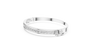 White gold channel-set diamond bangle with round stones, side view.