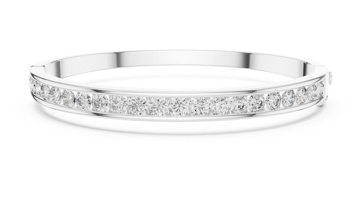 White-gold diamond channel-set bangle featuring a row of round stones