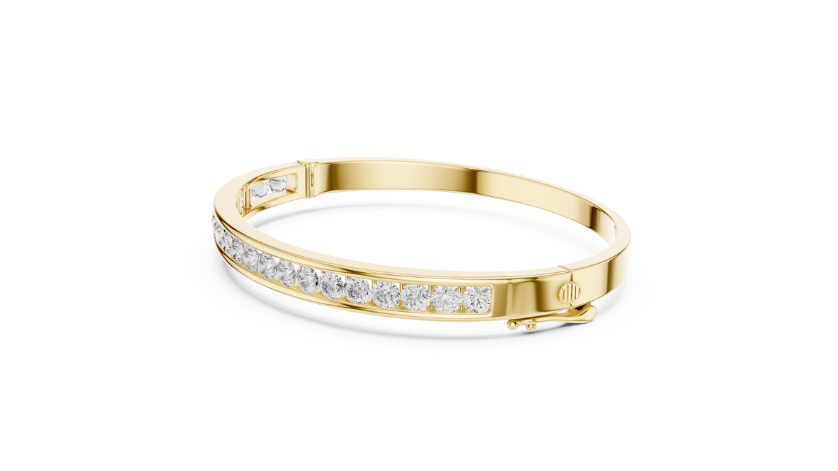 Diamond channel-set bangle with yellow-gold band and round stones along the front