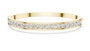 Yellow-gold diamond channel-set bangle with a continuous row of round stones