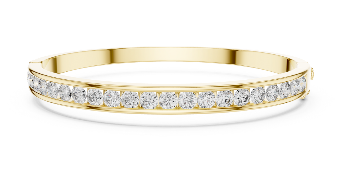 Yellow-gold diamond channel-set bangle with a continuous row of round stones