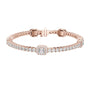 Rose gold tennis bracelet with emerald-cut diamond center halo and pave links