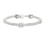White gold tennis bracelet with emerald-cut diamond center halo and diamond pave