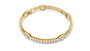 Yellow gold diamond tennis bracelet with emerald-cut center stone and rectangular pave links