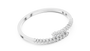 White gold bypass diamond bangle, angled view with pavé round stones.