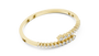 Yellow gold bypass diamond bangle, angled view with pavé round stones.