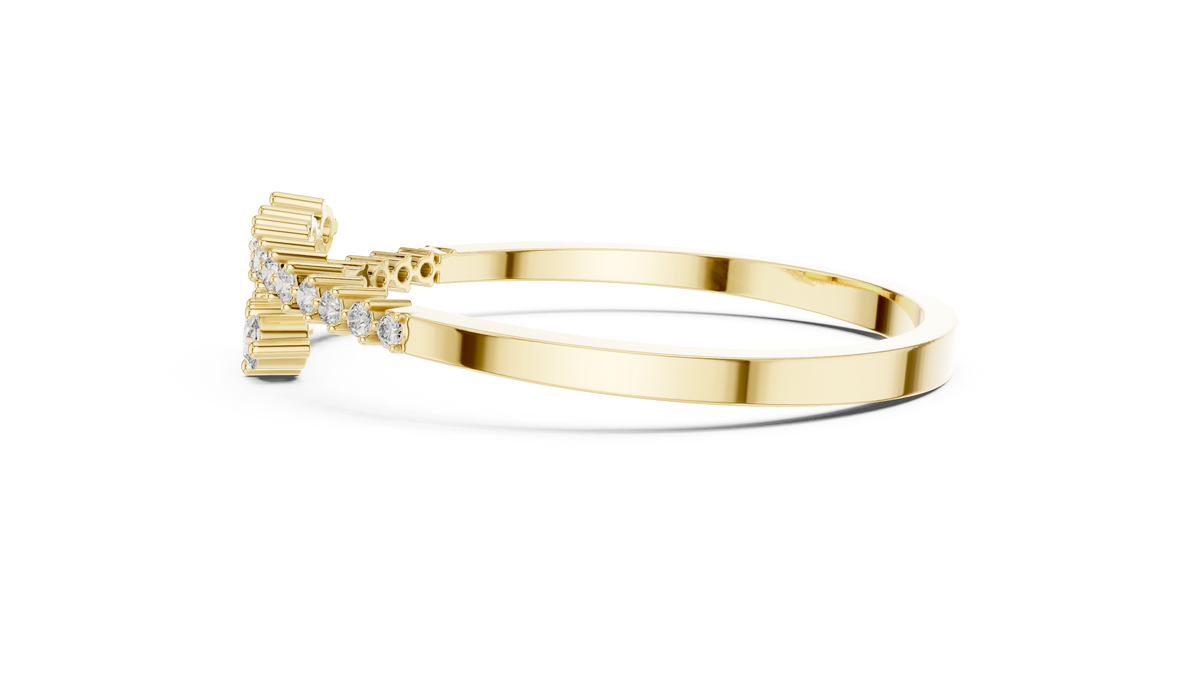 Diamond statement bypass bangle, yellow gold with round stones along the top.