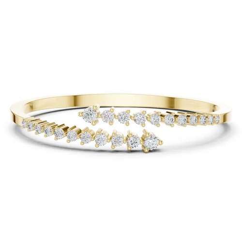 Diamond statement bypass bangle, yellow gold with prong-set round diamond rows.