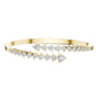 Diamond statement bypass bangle, yellow gold with multiple rows of round stones.