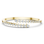 Diamond statement bypass bangle, yellow gold with multiple rows of round stones.