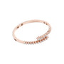 Rose gold bypass diamond bangle, angled view with pavé round stones.