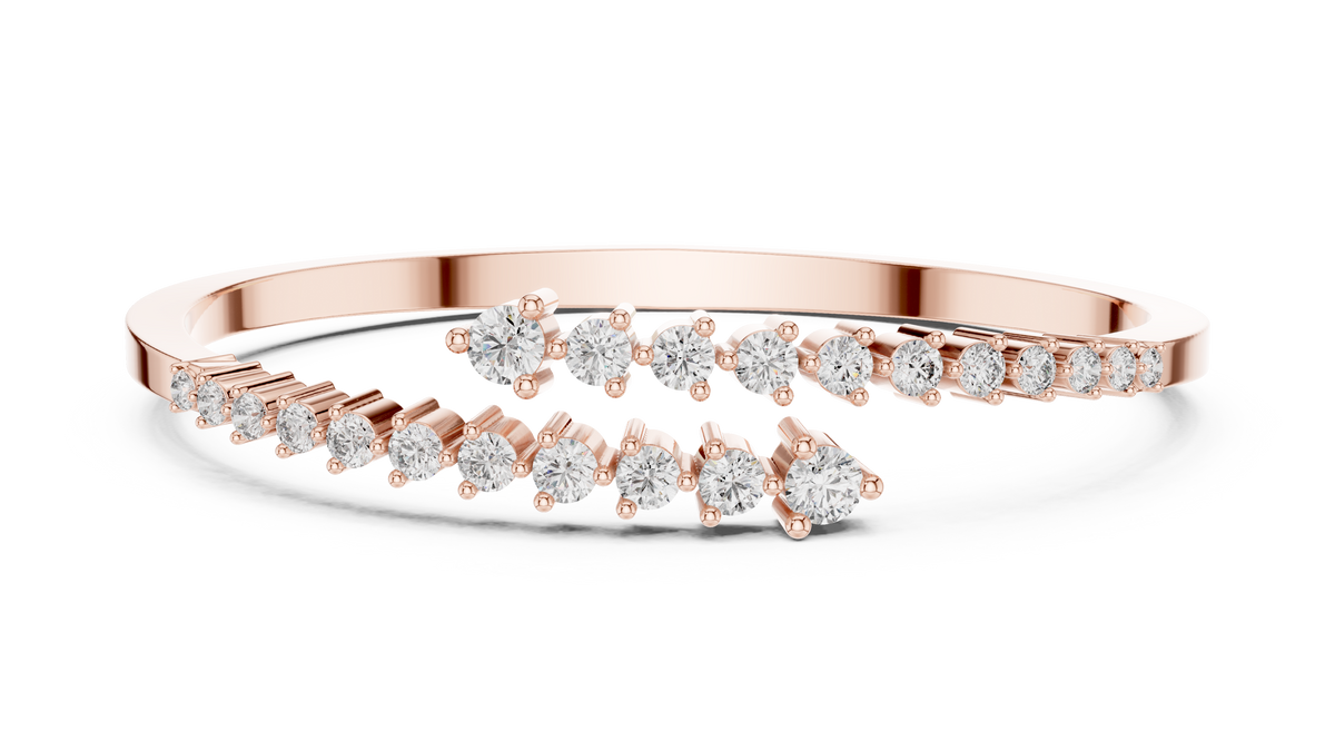 Rose gold bypass bangle with round diamond pavé accents.