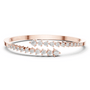 Diamond statement bypass bangle, rose gold with stacked round stones and prongs.